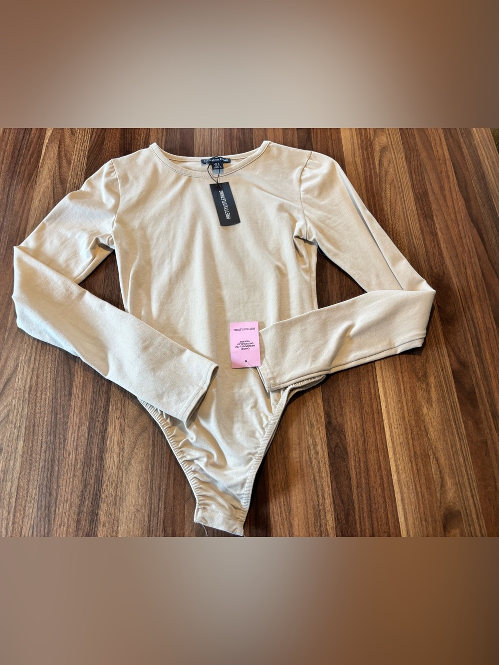 PrettyLittleThing Cream Long Sleeve Scoop Bodysuit